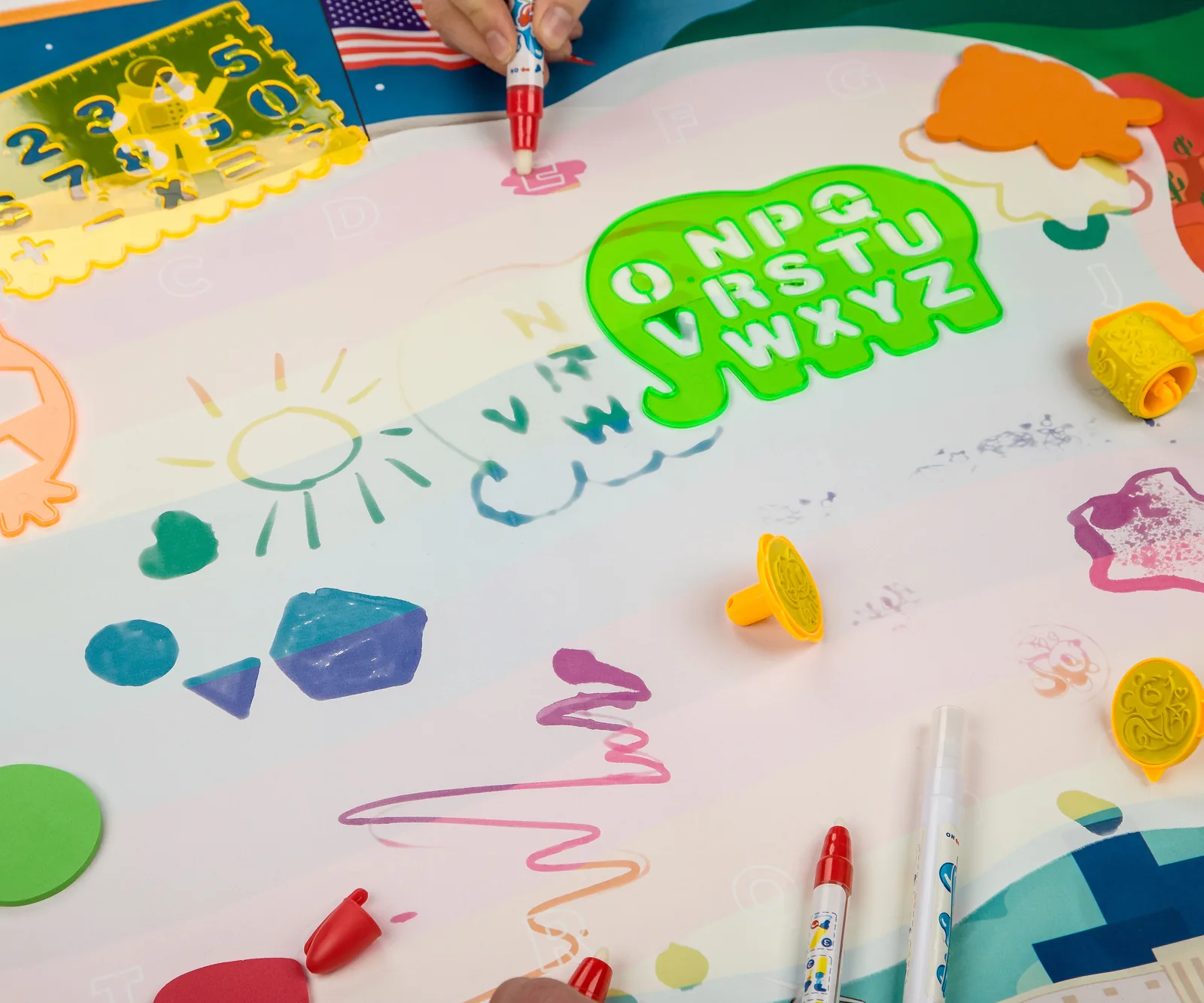 Drawing with a water marker on the LuminoLab mat — color appears mid-stroke